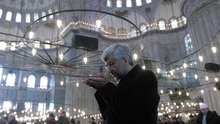 Iran's chief nuclear negotiator Said Jalili prays at a mosque in Istanbul. Photo: Ali Hassan Pour/AFP/Getty Images