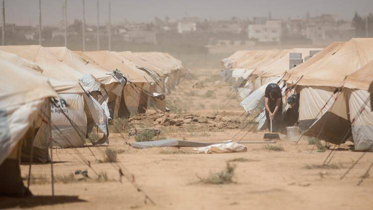 A sand storm at the Zaatari refugee camp, near Mafraq in northern Jordan. Photo: Thomas Trutschel/Photothek via Getty