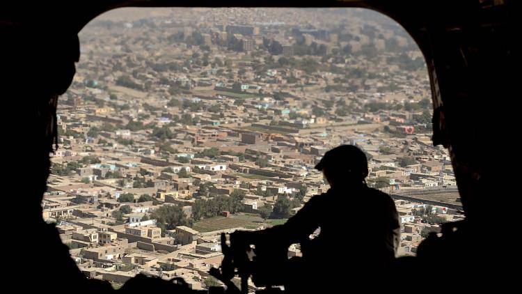 A US helicopter gunship flies over Kabul. Photo: Shah Mari/AFP/Getty Images