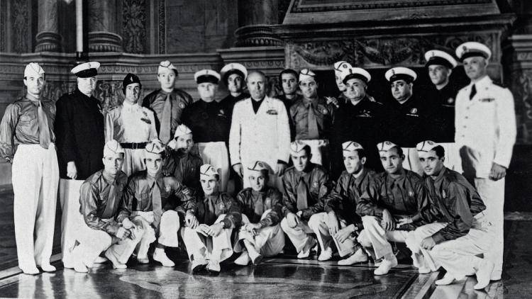 Benito Mussolini poses surrounded by the Italian national football team following their World Cup win in 1938. Photo: Staff/AFP/Getty Images