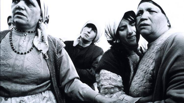 Women mourn the death of a Kosovo Liberation Army fighter who died defusing land mines in October 1998 during the ethnic Albanian majority’s war against Serbian troops under the leadership of Slobodan Milosevic