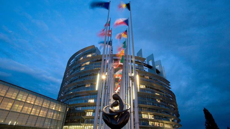 Flags of European countries fly outside the European Parliament in Strasbourg, France.