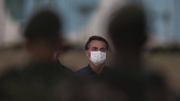 President Bolsonaro wears a surgical mask after contracting the coronavirus