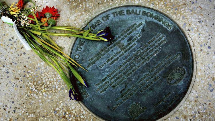 Flowers are laid at the Bali Bombing memorial at Dolphin Point on Coogee beach October 4, 2005 in Sydney, Australia