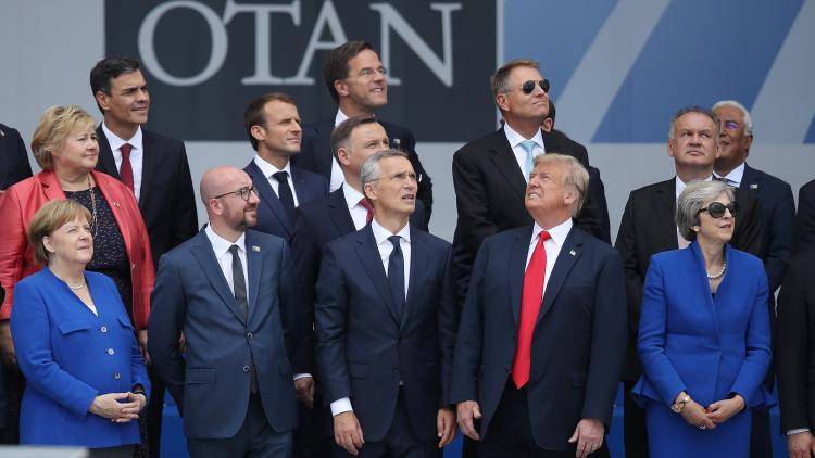 Differing views: Donald Trump and European leaders attend the opening ceremony of the 2018 Nato summit in Brussels