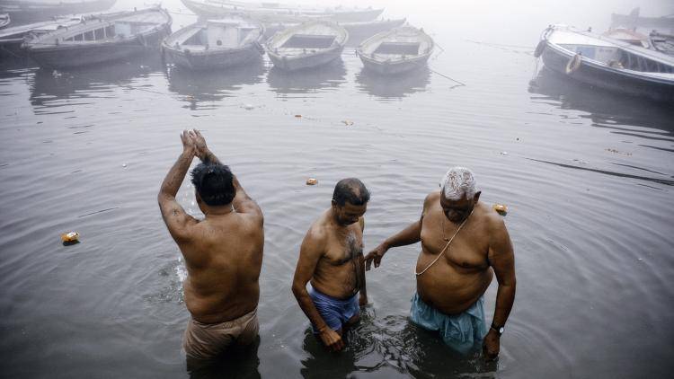 Indians bathe in India’s holiest river, the Ganges, which is worshipped as a living goddess