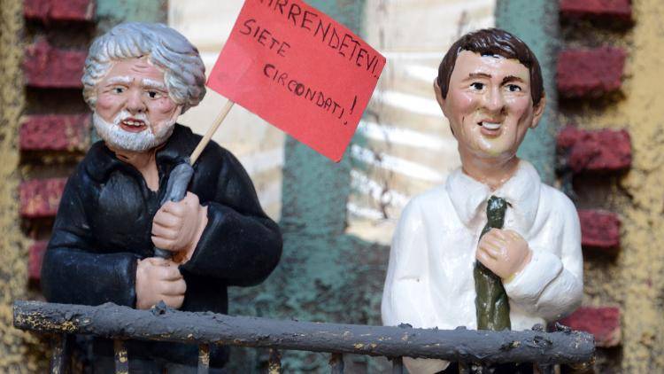 Figurines of the leader of the Five Star Movement Beppe Grillo and Italian Prime Minister Matteo Renzi in Naples