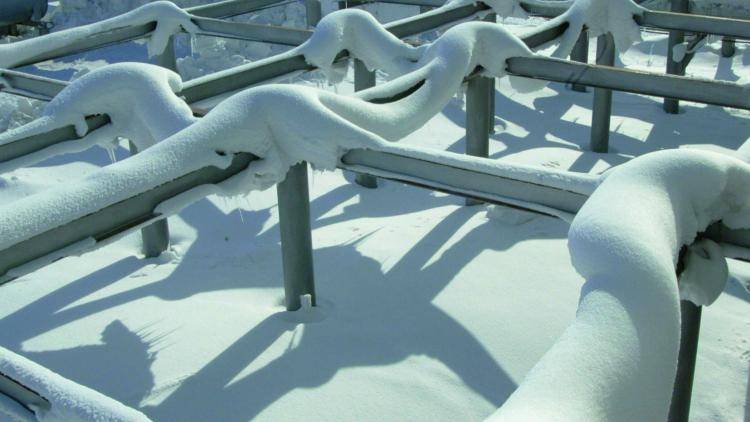 Pipeline under snow at the Roseneft Val Gamburtseva oil fields in Russia.