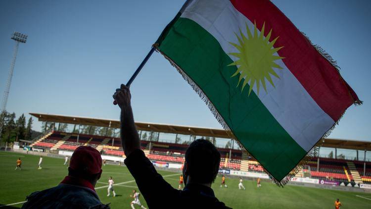A Kurdish flag flies at a CONIFA World Cup match between Tamil Eelam and Kurdistan. The competition is for stateless peoples not recognized by FIFA