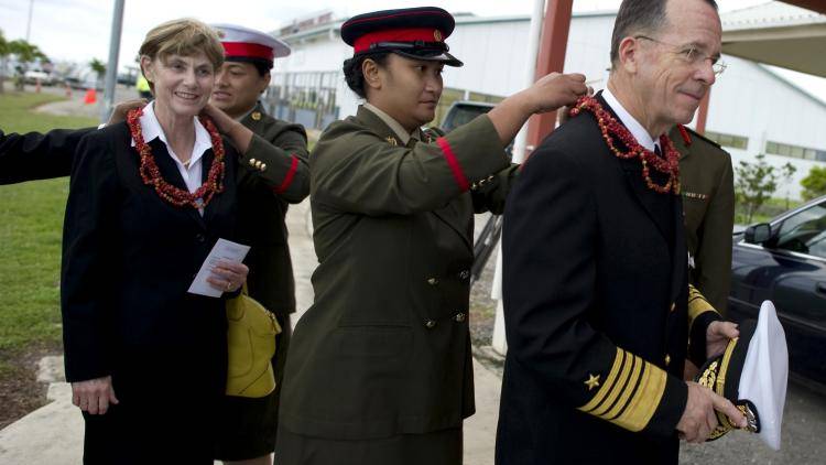 US Navy Adm. Mike Mullen and his wife receive leis upon their arrival in Tonga.