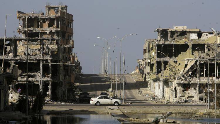 Destroyed buildings stand in Sirte's sector 2 neighbourhood. 