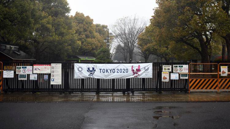 A banner for the Tokyo 2020 Olympic Games is displayed on a gate of the closed Yoyogi Park in Tokyo, Japan