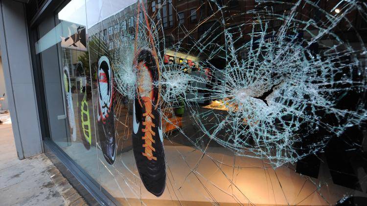 Damage to a fashion retail store is pictured in Manchester City Centre.