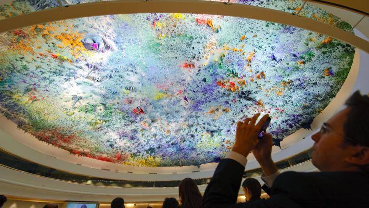 A guest snaps a picture of the roof of the United Nations' Human Rights Room, Geneva.