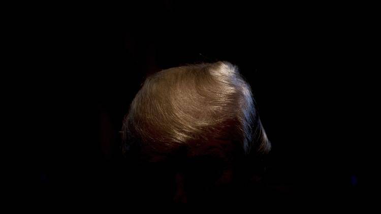 US President Donald Trump's hair shines as he speaks during a cabinet meeting at the White House in Washington, DC, on January 10, 2018. (Photo by JIM WATSON / AFP) Getty Images.