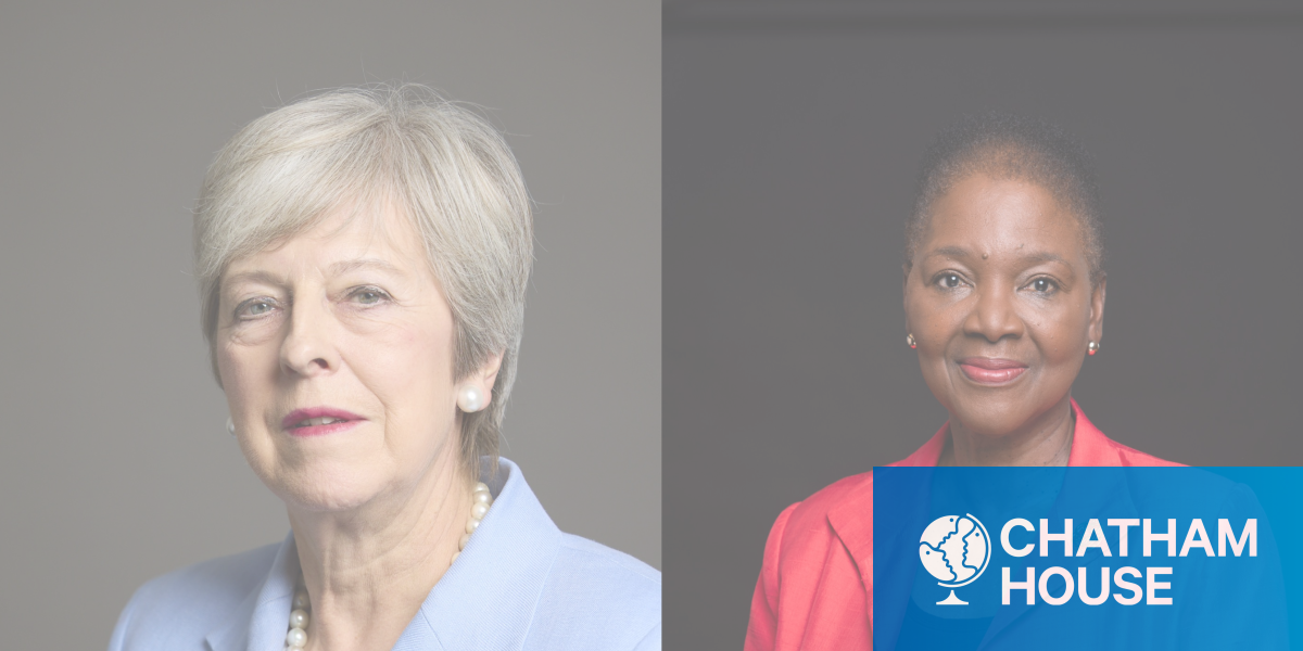 May wears a pale blue jacket; Amos is in a red jacket. Both women are positioned against different dark backgrounds, staring straight at the camera 