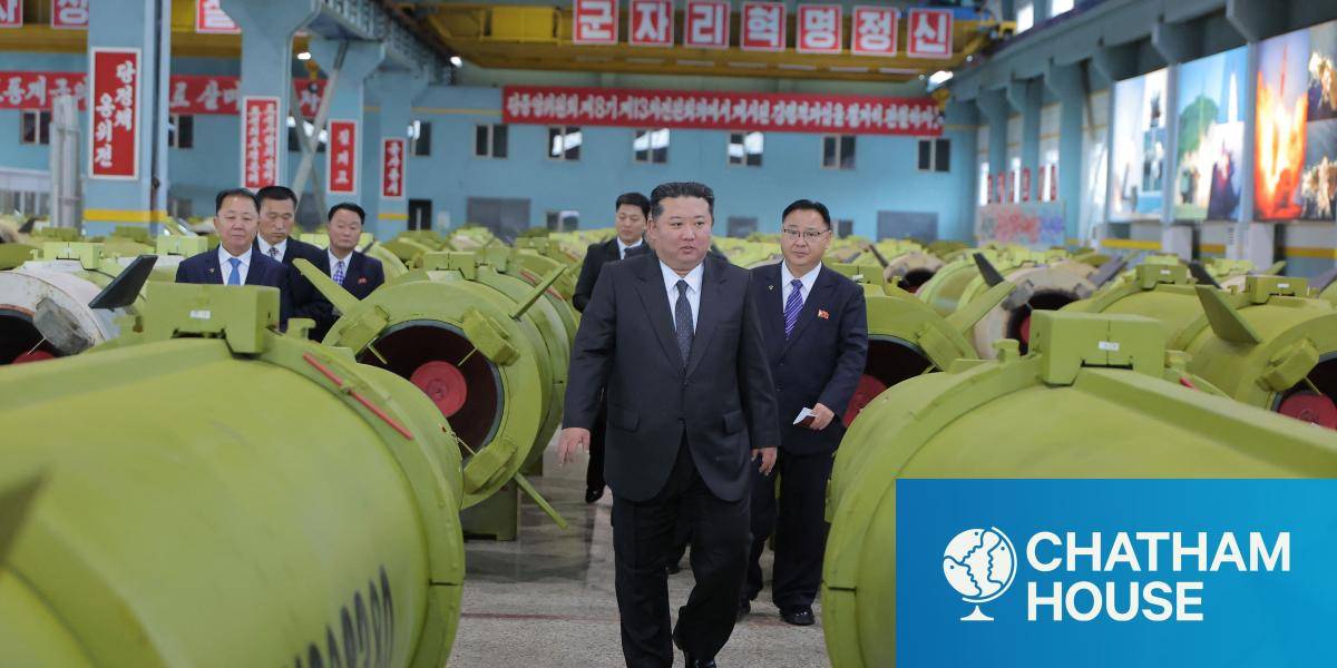 North Korean leader Kim Jong Un (C) visiting major munitions industry enterprises.