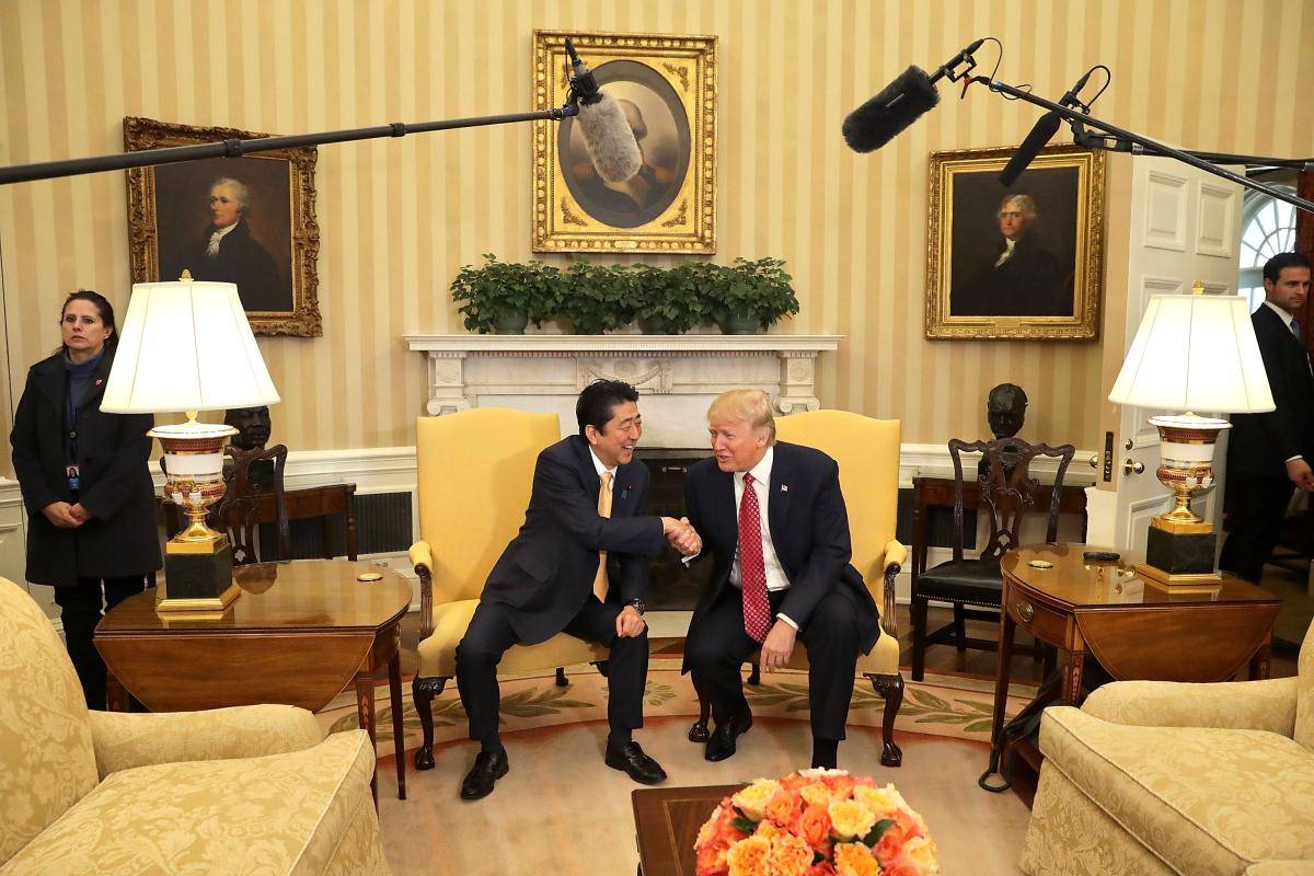 US President Donald Trump and Japanese Prime Minister Shinzo Abe pose for photographs before bilateral meetings on 10 February 2017 in Washington, DC. Photo: Chip Somodevilla/Staff/Getty Images.