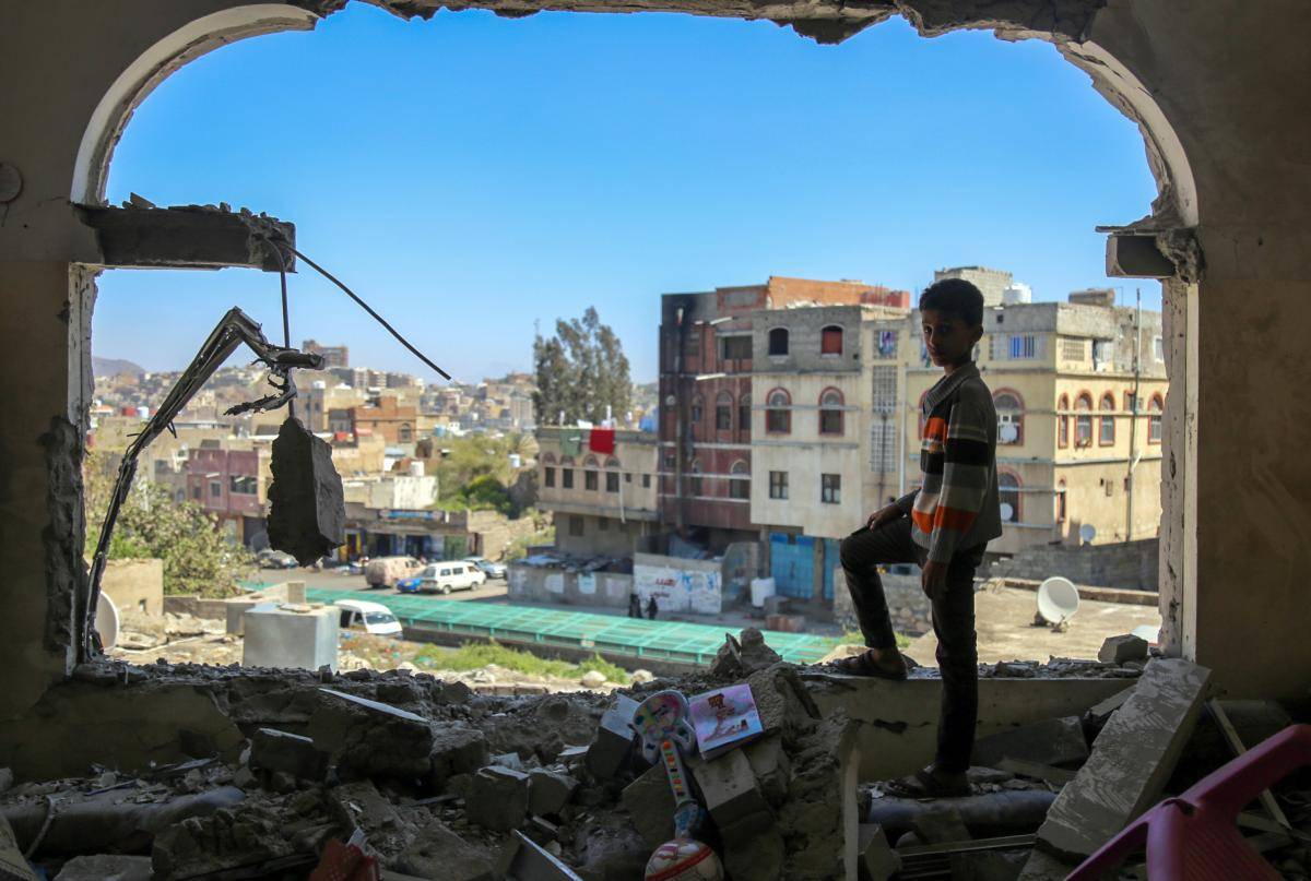 A Yemeni boy checks damage following a mortar attack in the city of Taiz, February 2016. Photo: Ahmad al-Basha/AFP/Getty Images