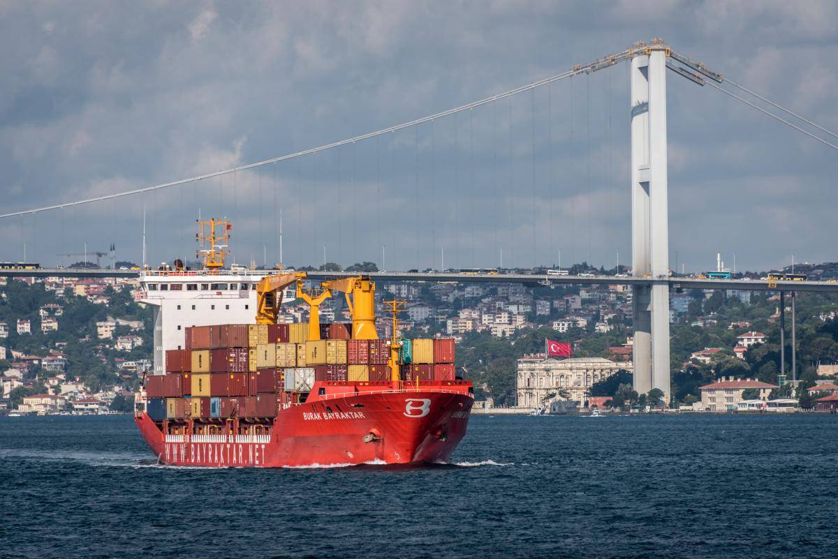 A container ship passes under the Fatih Sultan Mehmet Bridge while navigating the Bosphorus Straits. Istanbul, Turkey, 8 August 2018.
