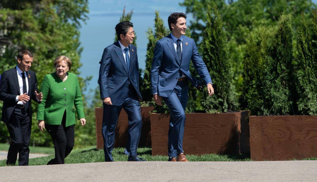 French President Emmanuel Macron, German Chancellor Angela Merkel, Japanese Prime Minister Shinzo Abe and Canadian Prime Minister Justin Trudeau during the G7 Summit in La Malbaie, Quebec, Canada on 8 June 2018.