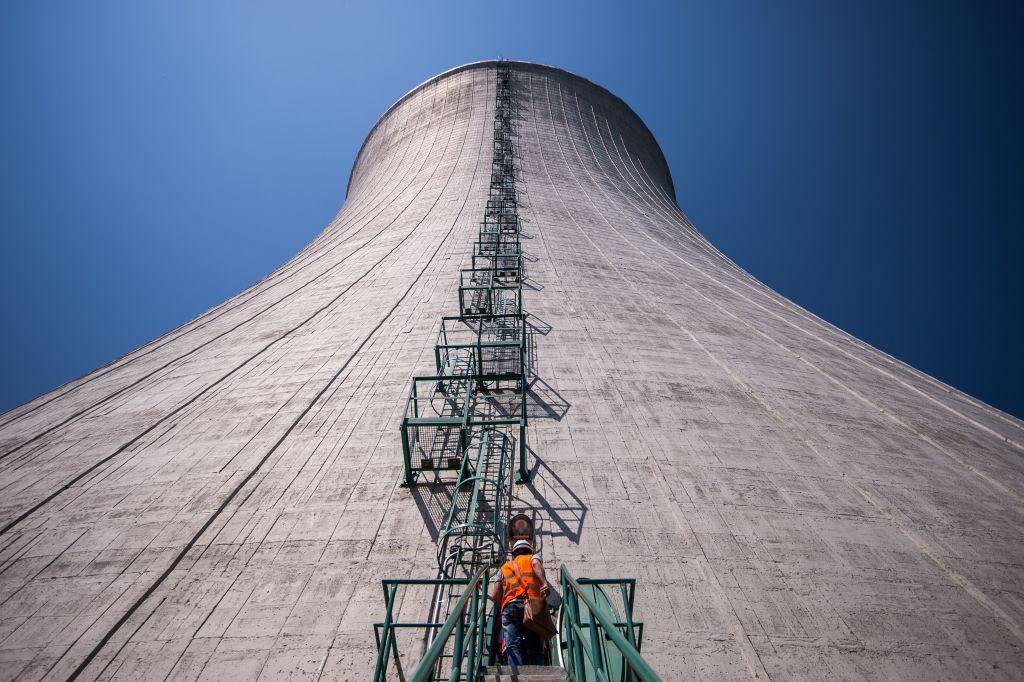 An employee climbs into the cooling tower of the third and fourth unit at Mochovce nuclear power plant in Slovakia on 2 July 2019. Photo: Getty Images