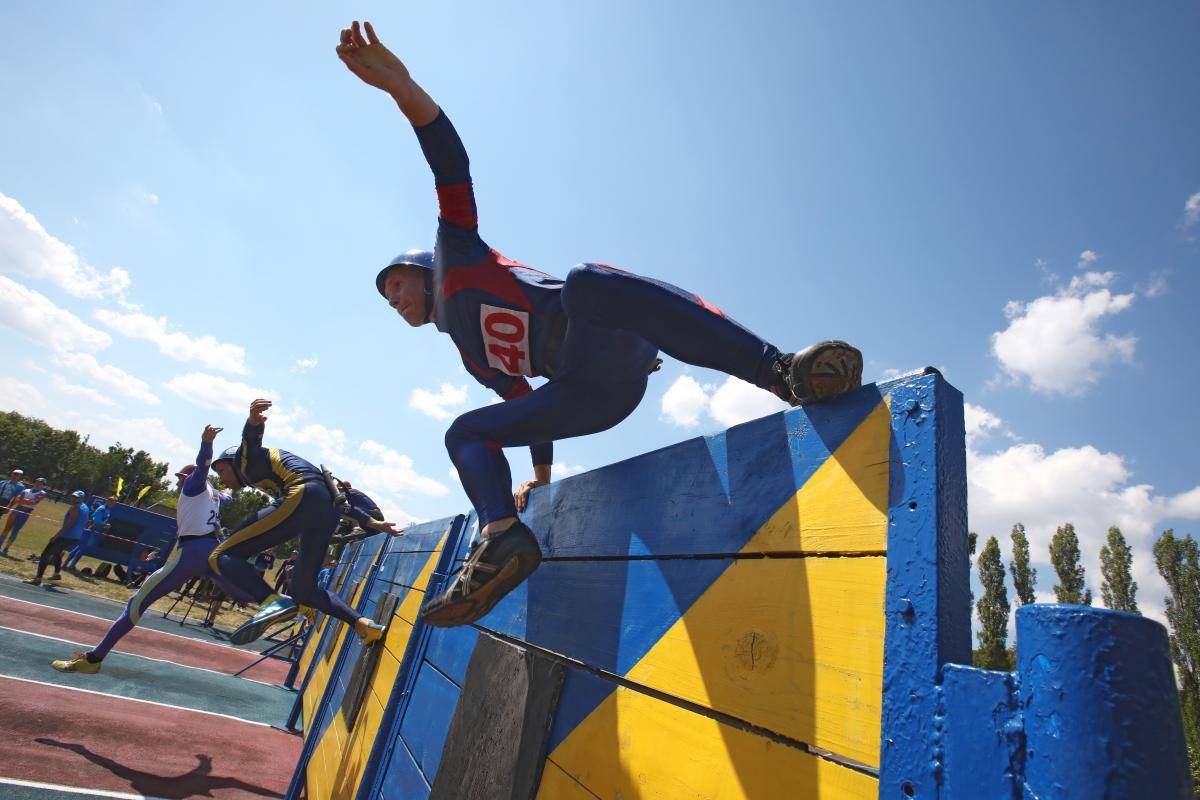 Competitors during the 27th Ukrainian Firefighting Championship in Kharkiv, Ukraine. Photo by Vyacheslav Madiyevskyy/Barcroft Media/Getty Images.