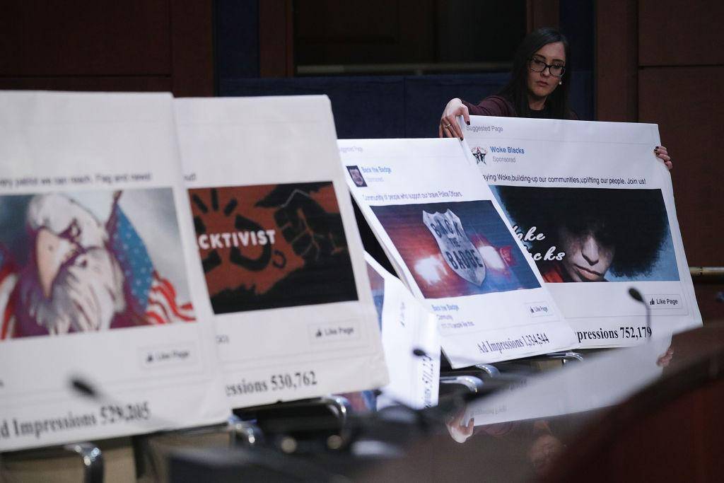 A congressional staff member displays print outs of social media posts during a hearing before the House Select Intelligence Committee 1 November 2017 in Washington, DC. Photo: Getty Images.