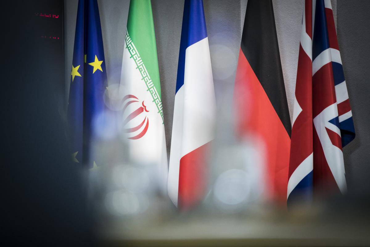 The flags of the EU, Iran, France, Germany and the UK are pictured before meetings on 15 May 2018 in Brussels, Belgium, in response to the US’s announcement of its withdrawal from the Iran nuclear deal. Photo: Florian Gaertner/Photothek/Getty