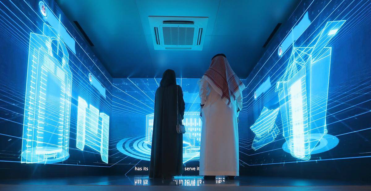 Saudi nationals attend the Gitex 2018 exhibition at the Dubai World Trade Center in Dubai
on 16 October 2018.