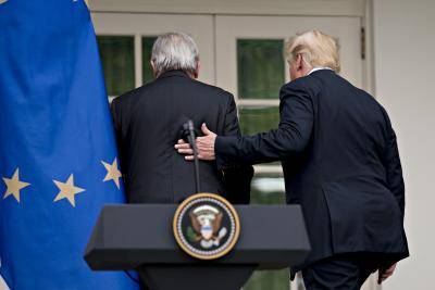 US President Donald Trump and President of the European Commission Jean-Claude Juncker walk away after the conclusion of a joint statement in the Rose Garden of the White House in Washington, DC on 25 July 2018. Photo credit: Getty Images