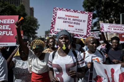 Women hold signs during a protest against repeated failures to apply laws that women must hold at least a third of government seats in Nairobi, Kenya, on 22 January 2018. According to Kenya's 2010 constitution, women must have at least a third of seats in parliament and a third of appointed positions. Photo: Getty Images.