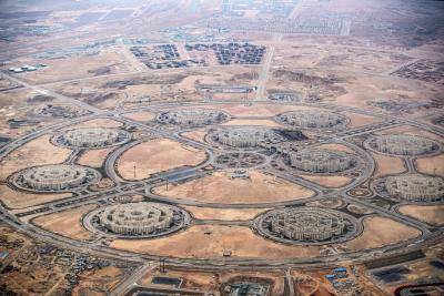 Aerial view of ongoing construction at Egypt's New Administrative Capital megaproject, 45 kilometres east of Cairo. Photo by KHALED DESOUKI/AFP via Getty Images.