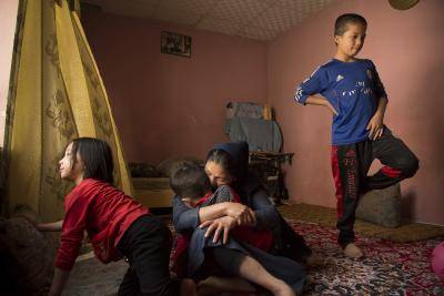 A mother with three of her five children at their home in Kabul