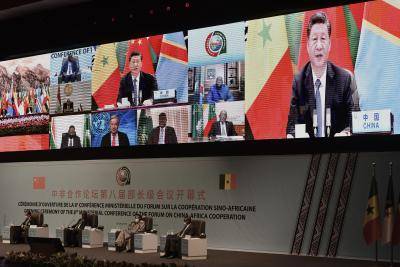 Chinese president Xi Jinping delivers his speech during the November 2021 China-Africa Cooperation (FOCAC) meeting in Dakar, Senegal, pledging to offer one billion COVID-19 vaccine doses to Africa. Photo by SEYLLOU/AFP via Getty Images.