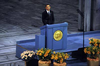 Barack Obama at a podium accepting the Nobel Peace Prize