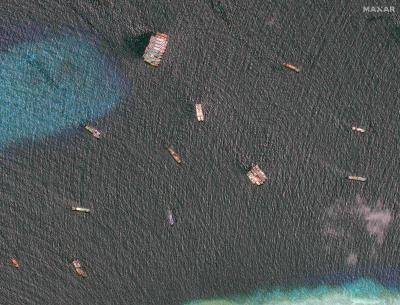 Satellite image showing fleet of suspected Chinese maritime militia fishing vessels moored at Union Banks 150m west of Second Thomas Shoal