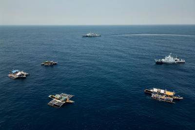 A Chinese Coast Guard ship with hull number 4203 is seen closely shadowing the convoy of Filipino fishing boats and a Philippine Coast Guard ship, on 16 May 2024, less 80 Nautical Miles from the island of Luzon, in the Philippines.