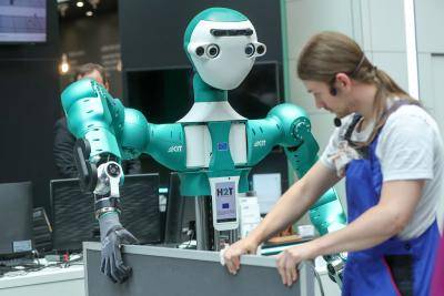 The Armar-6 humanoid robot takes part in a warehouse assistant demonstration at the CeBIT 2018 tech fair in Hanover, Germany, on 11 June 2018. Photo: Getty Images.