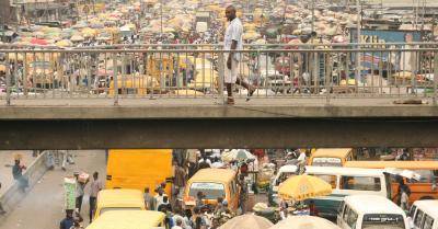 The daily bustle in one of the many busy markets in Lagos, yet the proportion of the Nigerian population still living on a dollar a day is 63 per cent. Photo: UIG via Getty Images
