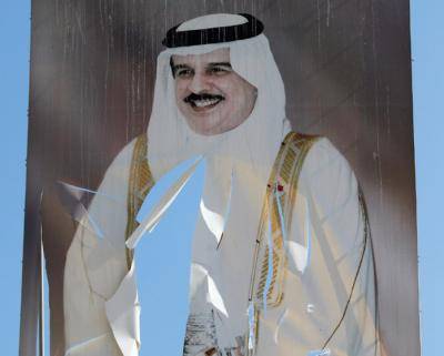 A tattered portrait of King of Bahrain Hamad bin Isa Al Khalifa. Photo: John Moore/Getty Images