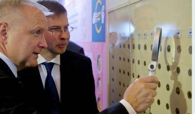 Valdis Dombrovskis, right, looks at designs for the Latvian euro coin. Photo: Ilmars Znotins/AFP/Getty