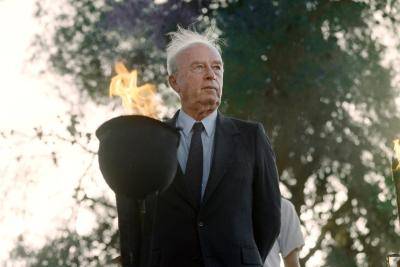 Israeli Prime Minister Yitzhak Rabin lights a flame on 19 May 1993 at a memorial on Jerusalem day, 26 years after he took the city as army chief of staff. Photo by Getty Images.