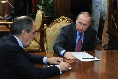 Vladimir Putin meets with Foreign Minister Sergei Lavrov at the Kremlin on 14 March 2016. Photo by Getty Images.