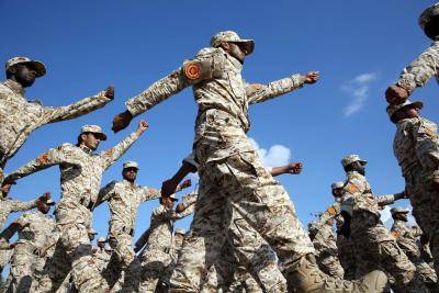 Libyan soldiers take part in a parade marking the 75th anniversary of the army's establishment at Martyr's Square in the Libyan capital, Tripoli, on 13 August 2015. Photo by Getty Images.