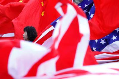 A woman takes part in a rally welcoming China's president Xi Jinping during the nuclear security summit in Washington DC on 1 April 2016. Photo: Getty Images.