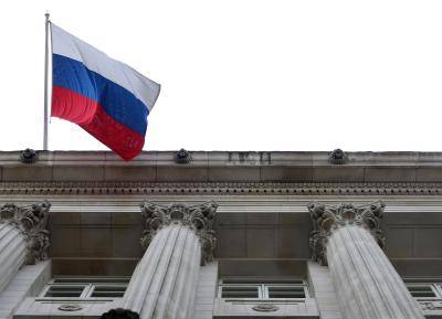 The Russian Federation flag flies outside VTB Capital's offices in London. Photo via Getty Images.