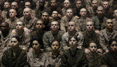 Female and male US Marine recruits listen to instructions during boot camp at MCRD Parris Island. Photo by Getty Images.
