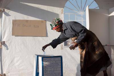 A South African woman casts her ballot for the municipal elections in Atteridgeville, west of Pretoria, on August 3, 2016. Photo by HERMAN VERWEY/AFP/Getty Images.