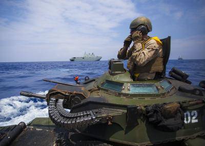 Cpl Ryan Dills communicates with other assault amphibious vehicles during the Rim of the Pacific multinational military exercise on 18 July 2016. Photo: US Marine Corps photo by Staff Sgt Christopher Giannetti.